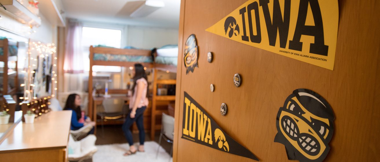 Residence hall door open, glmpse inside a room decorated with UI theme